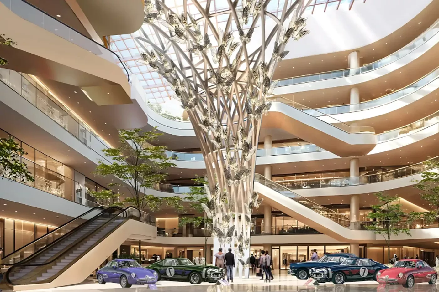 Spacious MVN Mall atrium with multi-level balconies, escalators, central butterfly sculpture, and vintage cars on display